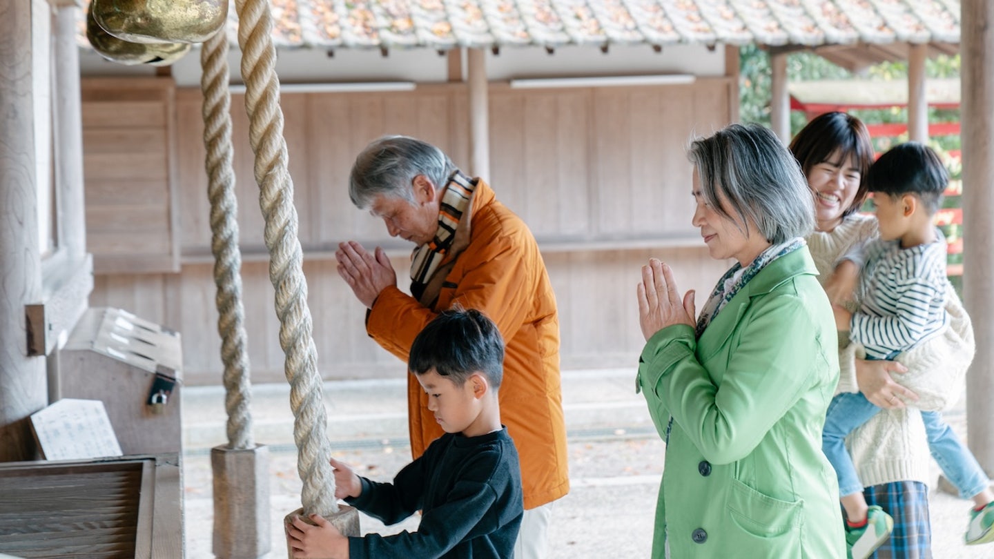 people praying okinawa