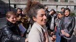 Masih Alinejad greets friends and supporters outside the federal courthouse