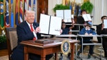 US President Donald Trump holds an executive order after signing it in the East Room of the White house in Washington, DC, March 20, 2025. US President Donald Trump will sign an order March 20, 2025 to start dismantling the Department of Education, fulfilling an election campaign pledge and a long-held dream of American conservatives. By law, the Education Department -- created in 1979 -- cannot be shuttered without the approval of Congress, and Republicans do not have the votes to push that through. (Photo by Mandel NGAN / AFP) (Photo by MANDEL NGAN/AFP via Getty Images)