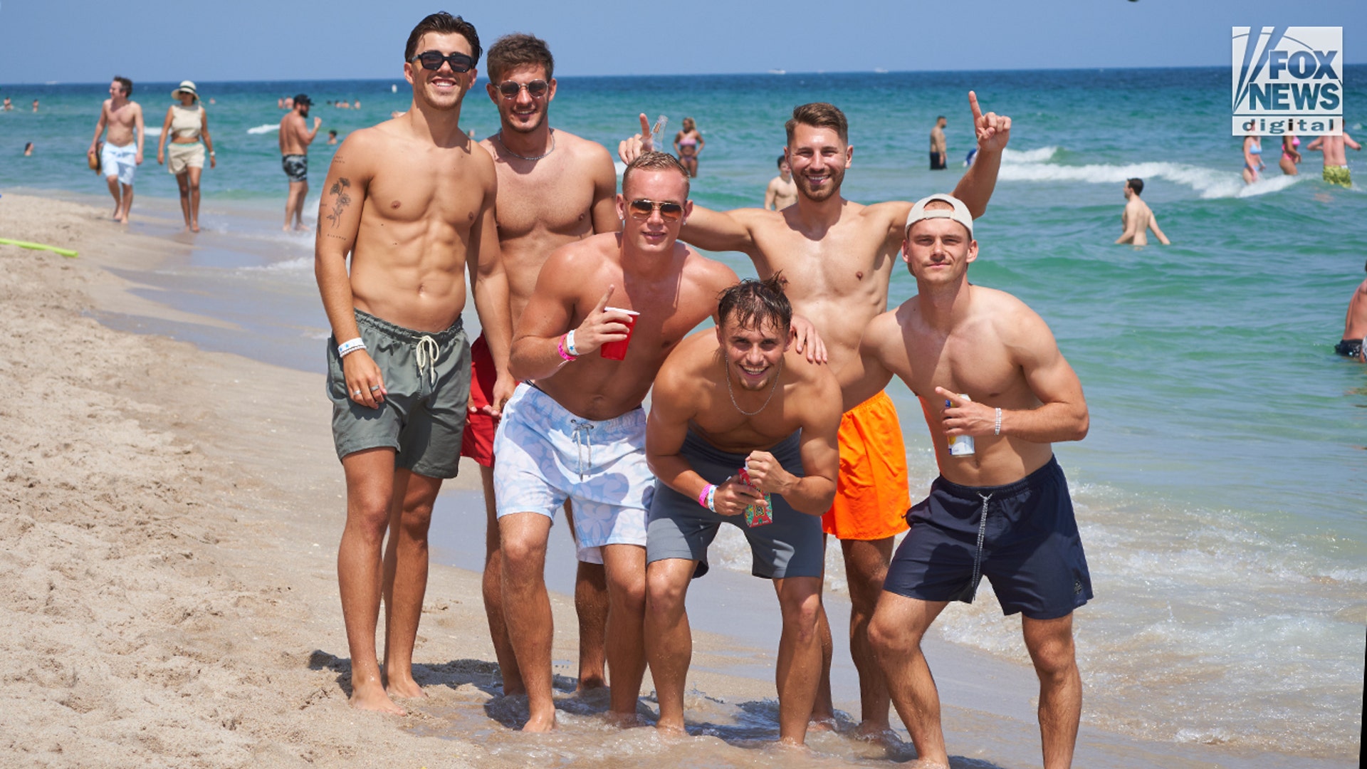 College men on beach