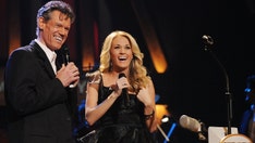 Carrie Underwood's tribute to Randy Travis moves Grand Ole Opry audience to tears