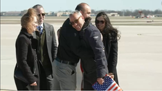 American released by Taliban returns home to 'champion's welcome'