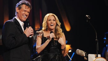 Carrie Underwood's tribute to Randy Travis moves Grand Ole Opry audience to tears