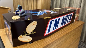 Man is buried in Snickers-themed coffin as he wished: 'I'm nuts'