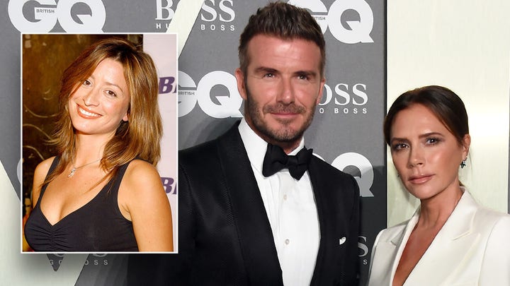 David Beckham waves to fans while walking the green carpet at the Earthshot Prize Awards