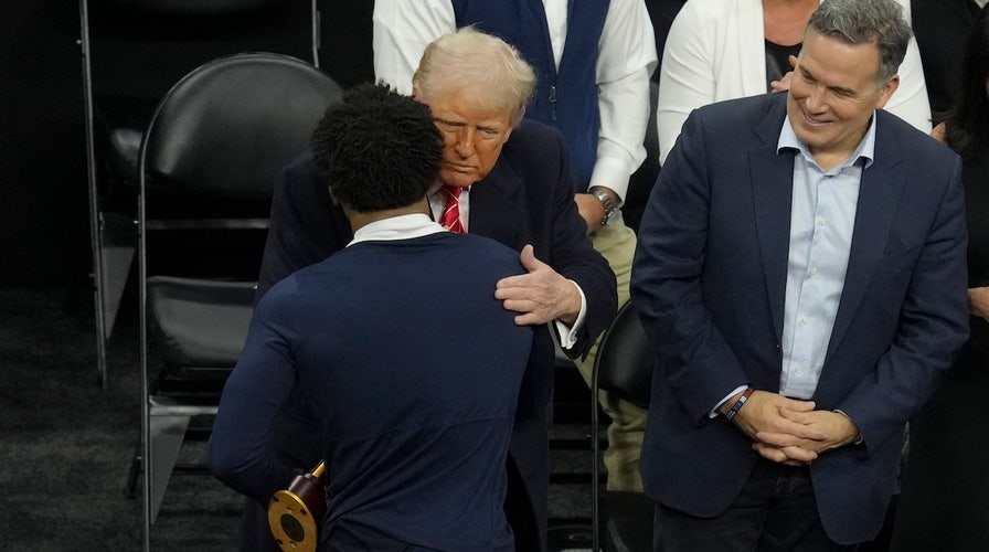 NCAA wrestler shakes hands with Trump, Musk after winning championship bout