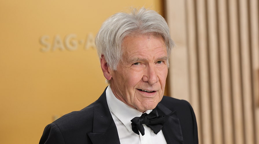 Harrison Ford walks the red carpet a the 2024 Critics Choice Awards