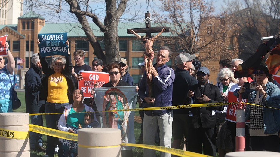 Iowa city council meeting erupts after former member opens meeting with satanic prayer and 'Hail Satan'