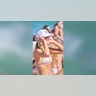 College woman in hat on beach
