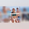 College women at volleyball net