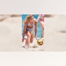 College women playing volleyball
