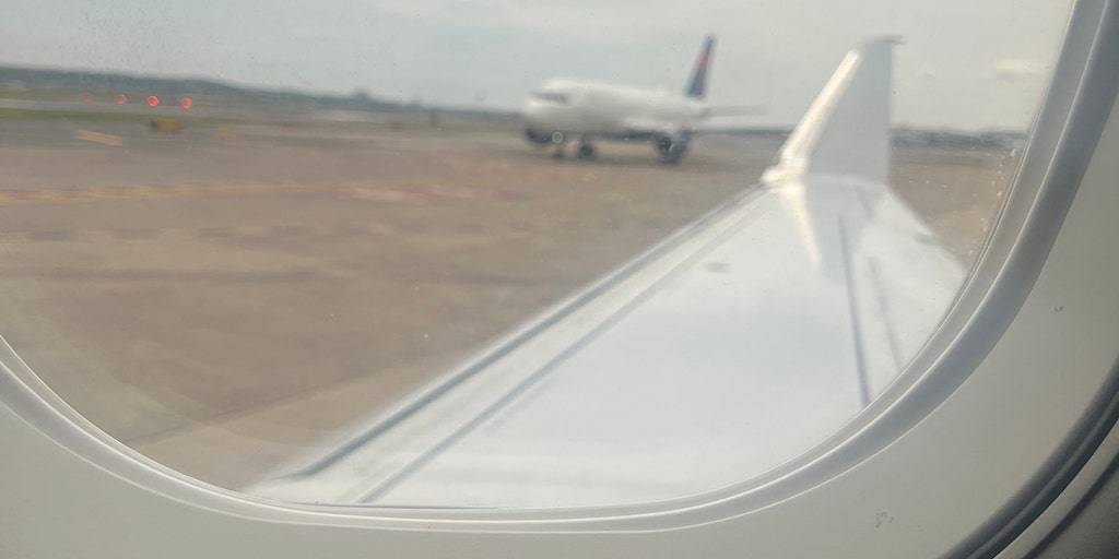 American Airlines flight carrying US lawmakers 'bumped' by second plane on tarmac in DC