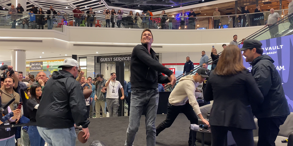 Tom Brady flashes legendary arm for fans at grand opening of new store; discusses Joe Montana, Super Bowl win