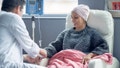 oncologist hooking up a woman battling cancer to an IV - Fox News