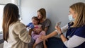 Los Angeles, CA - March 25: Dr. Neville Anderson, right, tries to cheer up and distract Iris Behnam, 4, while nurse Breanna Kirby, left, gives her DTap Polio and MMR Chickenpox (Varicilla) vaccinations while her mom, Haley Behnam, holds her at Larchmont Pediatrics in Los Angeles Tuesday, March 25, 2025. At the popular Larchmont Pediatrics, Dr. Neville Anderson requires all infants to begin their routine vaccinations by the three month visit. Parents who refuse receive a letter in the mail stating that they have 30 days to find a new doctor.
"If a parent is truly anti-vax and does not want to vaccinate their child, our values and our goals and our beliefs are so antithetical to each other that we're not a good team," said Anderson. "I'm not the right doctor for them, and they're not the right patient for me." Larchmont only dismisses 1-4 patients each year, she said, since most anti-vaccine families know their reputation and tend to go elsewhere. For some patients, the dismissal policy is a real draw. As yet another measles outbreak continues to spread in Texas and New Mexico, with the first two measles deaths in the U.S. in a decade, physicians are again facing a moral quandary: Should they refuse to see families who don't want to vaccinate their children, or keep them in their practices in the hopes of changing their minds? (Allen J. Schaben / Los Angeles Times via Getty Images) - Fox News