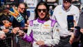 FILE - Driver Katherine Legge signs autographs before the start of a NASCAR Cup Series at Phoenix Raceway, Sunday, March 9, 2025, in Avondale, Ariz. - Fox News
