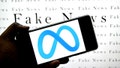 INDIA - 2025/03/19: In this photo illustration, a Meta logo is seen displayed on a smartphone with Fake news (illustrative writing) in the background. (Photo Illustration by Avishek Das/SOPA Images/LightRocket via Getty Images) - Fox News