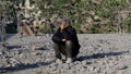 A Palestinian man sits on debris while covering his face with his hand at the site of an Israeli strike on a house, in Khan Younis in the southern Gaza Strip April 28, 2025. - Fox News