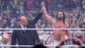 Paul Heyman raises Seth Rollins' hand after Rollins' Triple Threat match victory over CM Punk and Roman Reigns, both not pictured, during WrestleMania 41 at Allegiant Stadium on April 19, 2025 in Las Vegas, Nevada. - Fox News