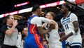 Detroit Pistons forward Ronald Holland II, center left, and Minnesota Timberwolves guard Donte DiVincenzo, center right, fight during the first half of an NBA basketball game, Sunday, March 30, 2025, in Minneapolis. - Fox News