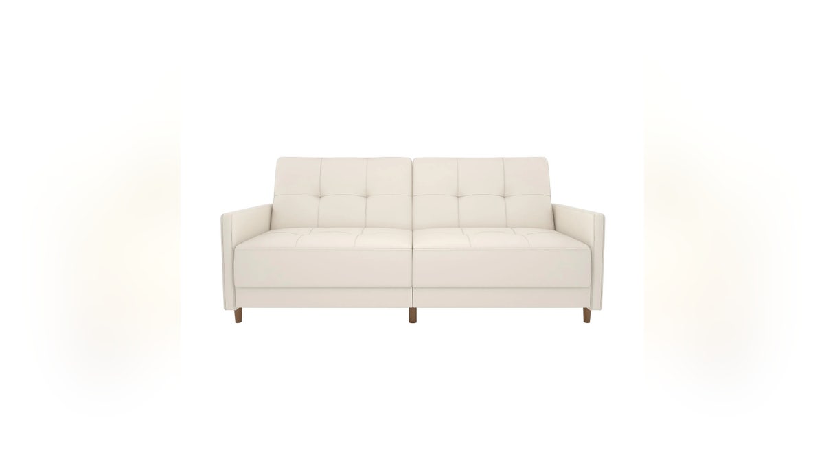 This Andora coil futon astatine  Ashley Furniture features foam padding implicit    independently encased coils for superior comfortableness  and a split-back design.