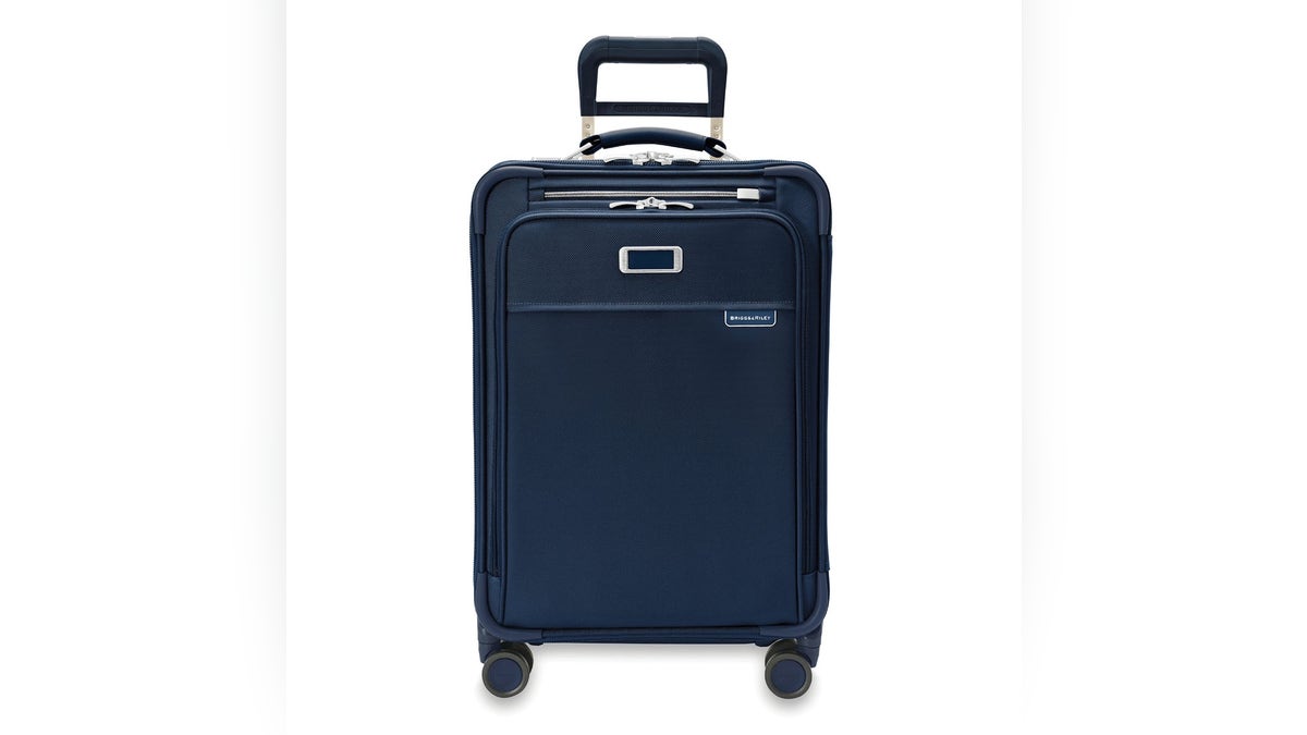 This Briggs & Riley fabric carry-on features compression-expansion technology, allowing for increased packing capacity without compromising size restrictions.