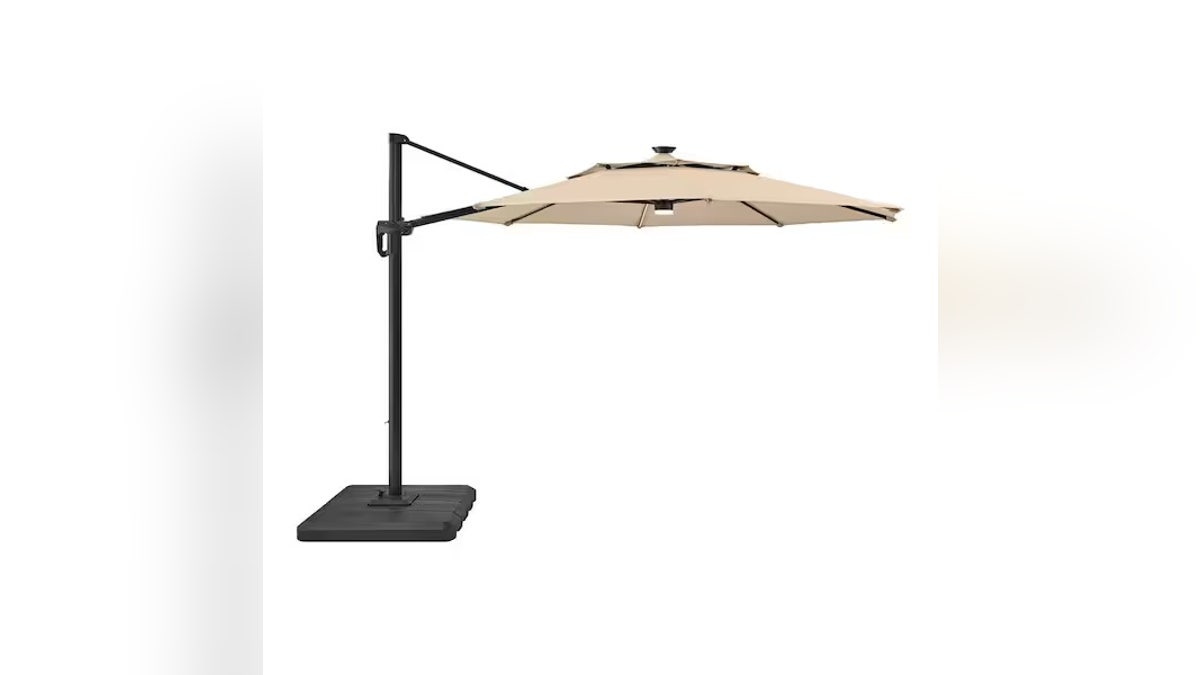Hampton Bay's offset umbrella provides ample shade and features built-in solar-powered LED lights.