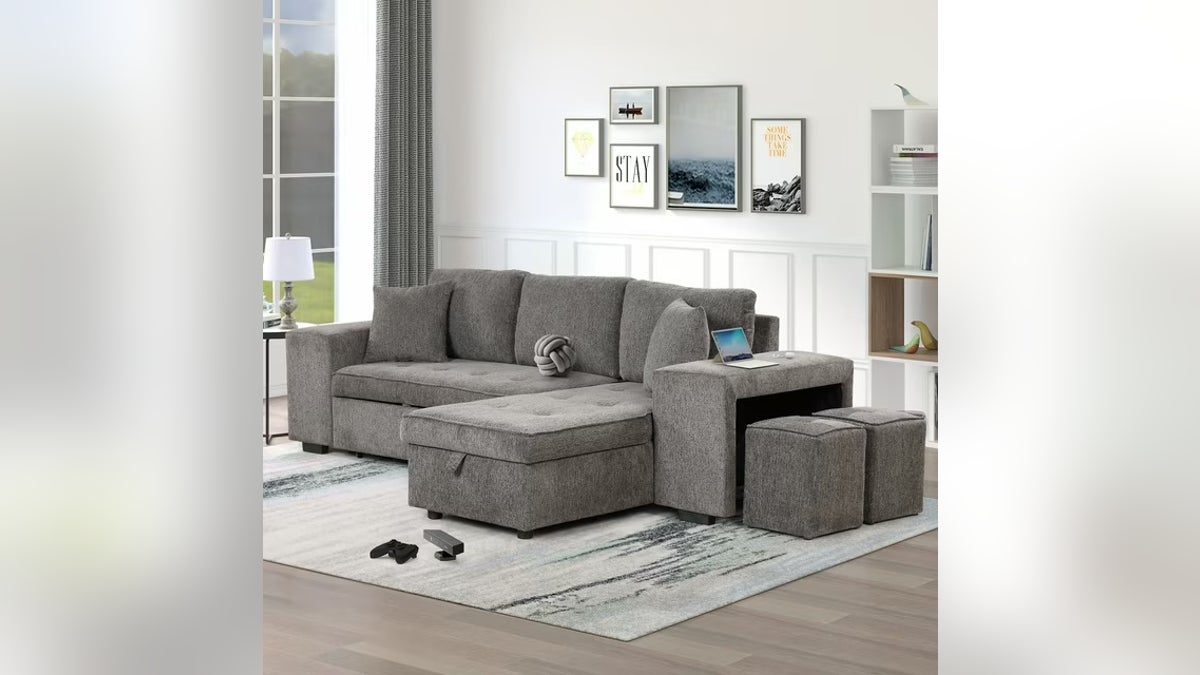 Williamspace's 104-inch sectional astatine  Walmart gives you tons  of bang for your subordinate  with a pull-out sleeper bed, retention  chaise and 2  stools.