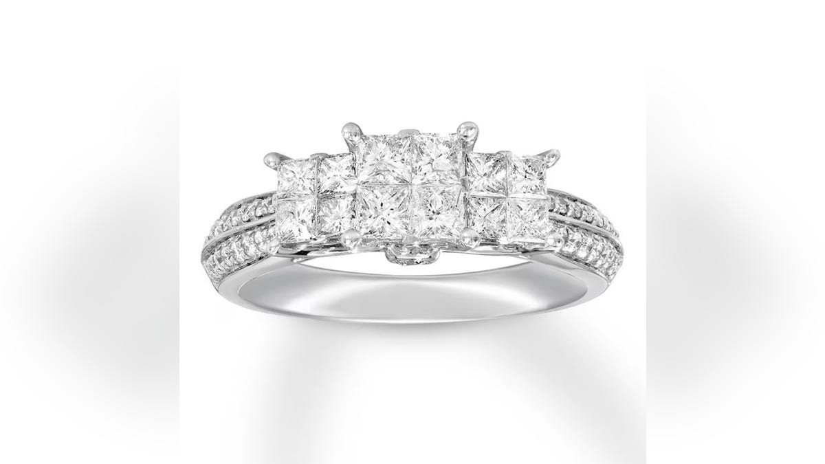 This three-stone ring at Kay Jewelers offers a larger princess-cut center diamond flanked by two smaller princess-cut diamonds.