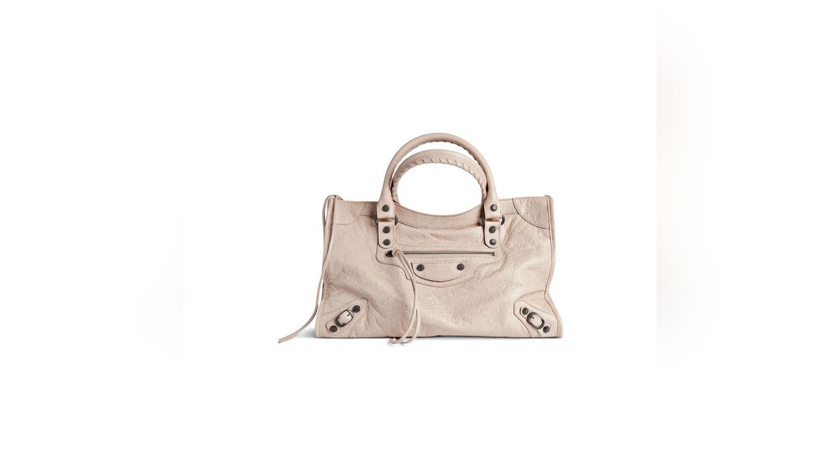 For the fashion-forward mom, the Balenciaga Classic City bag is an iconic choice.