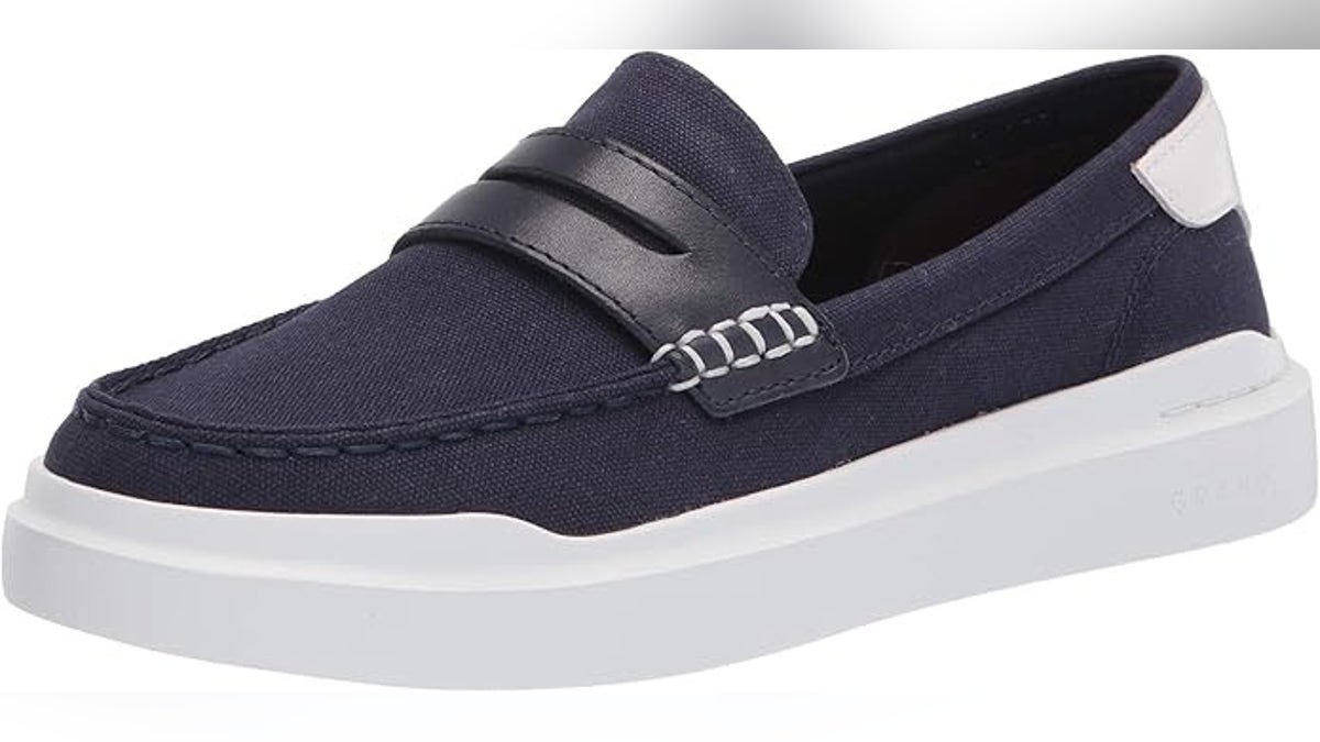 These women’s Cole Haan loafers combine classic style with modern comfort, featuring a lightweight EVA outsole and cushioned footbed in breathable canvas.