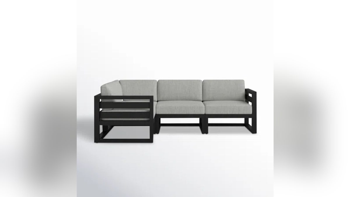 This sleek sectional by AllModern at Wayfair features thick cushions and bold lines, offering both comfort and a modern feel. 