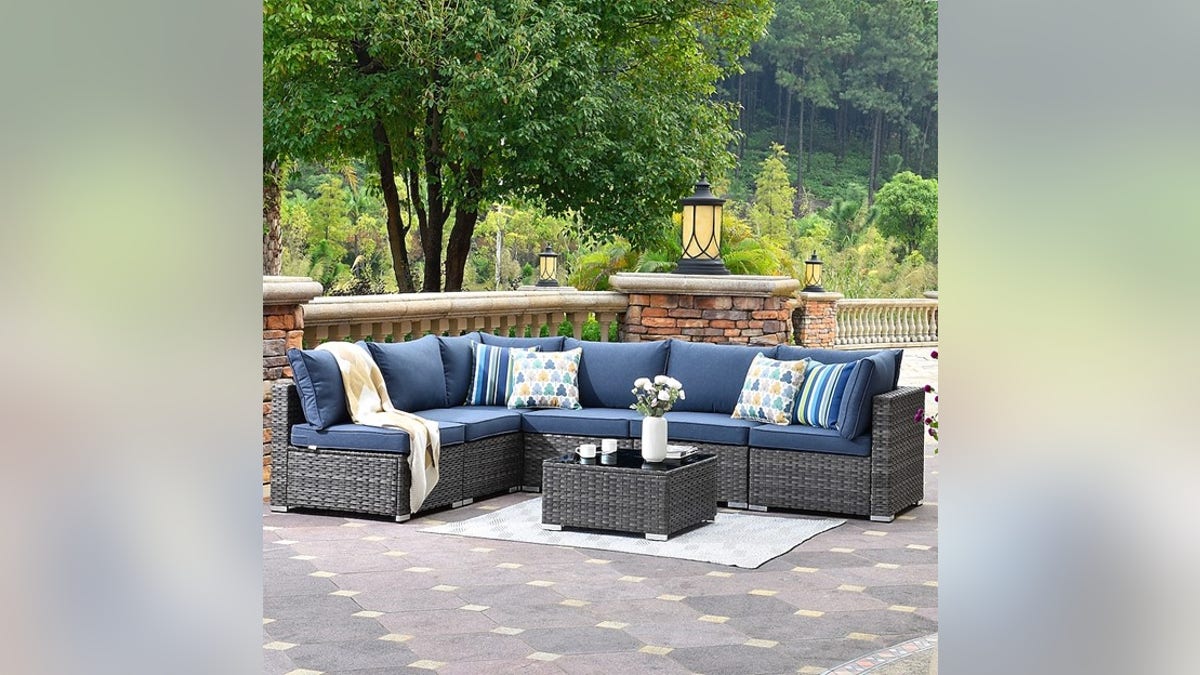 A large, comfy outdoor couch and table pair.