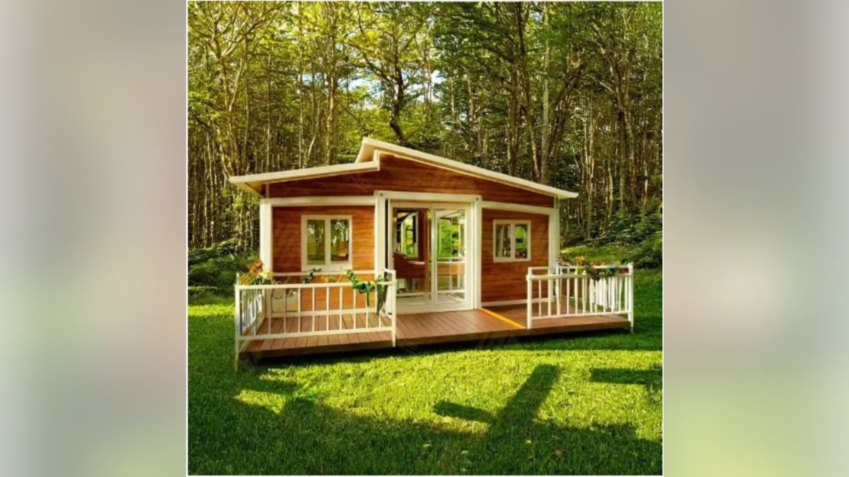 A unique tiny house with a large front porch.?