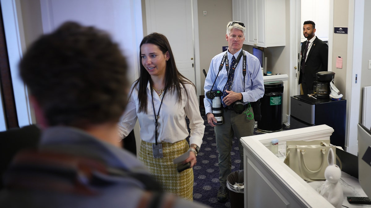 Associated Press photojournalist walking