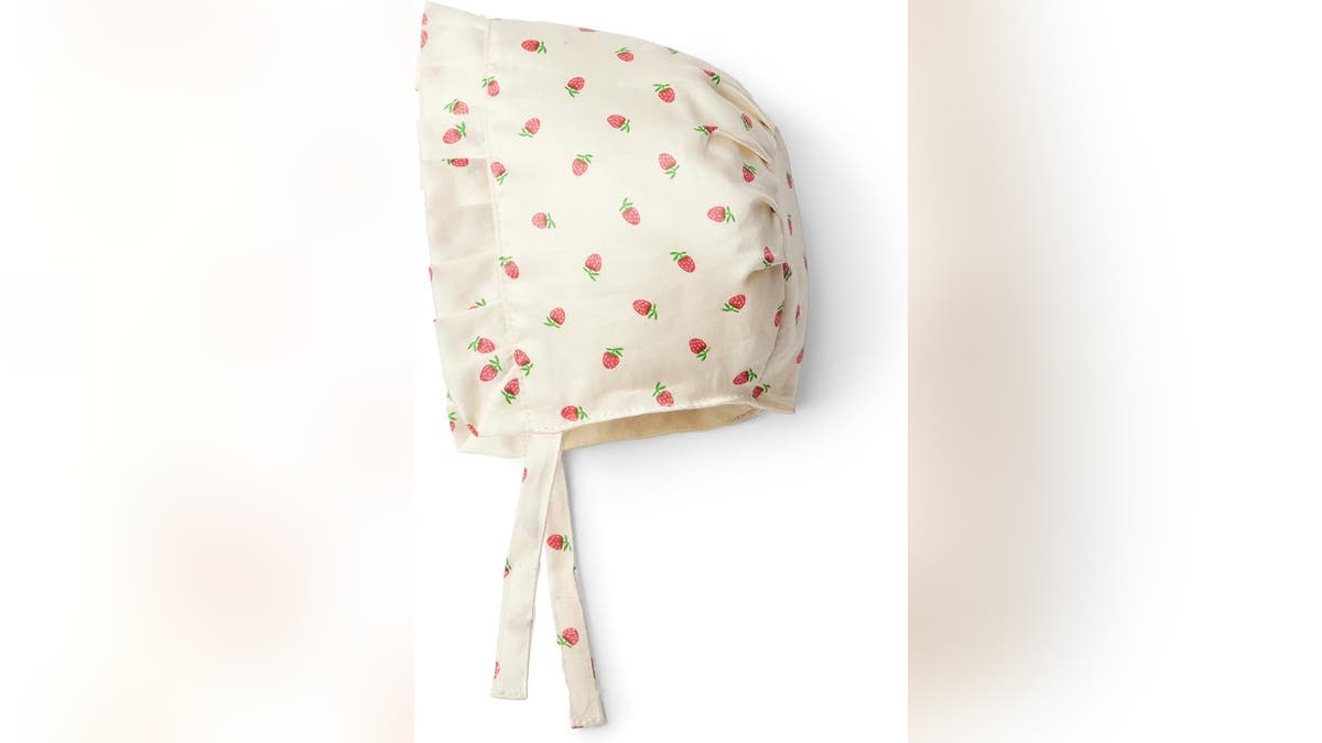 Pair the dress with a matching bonnet.