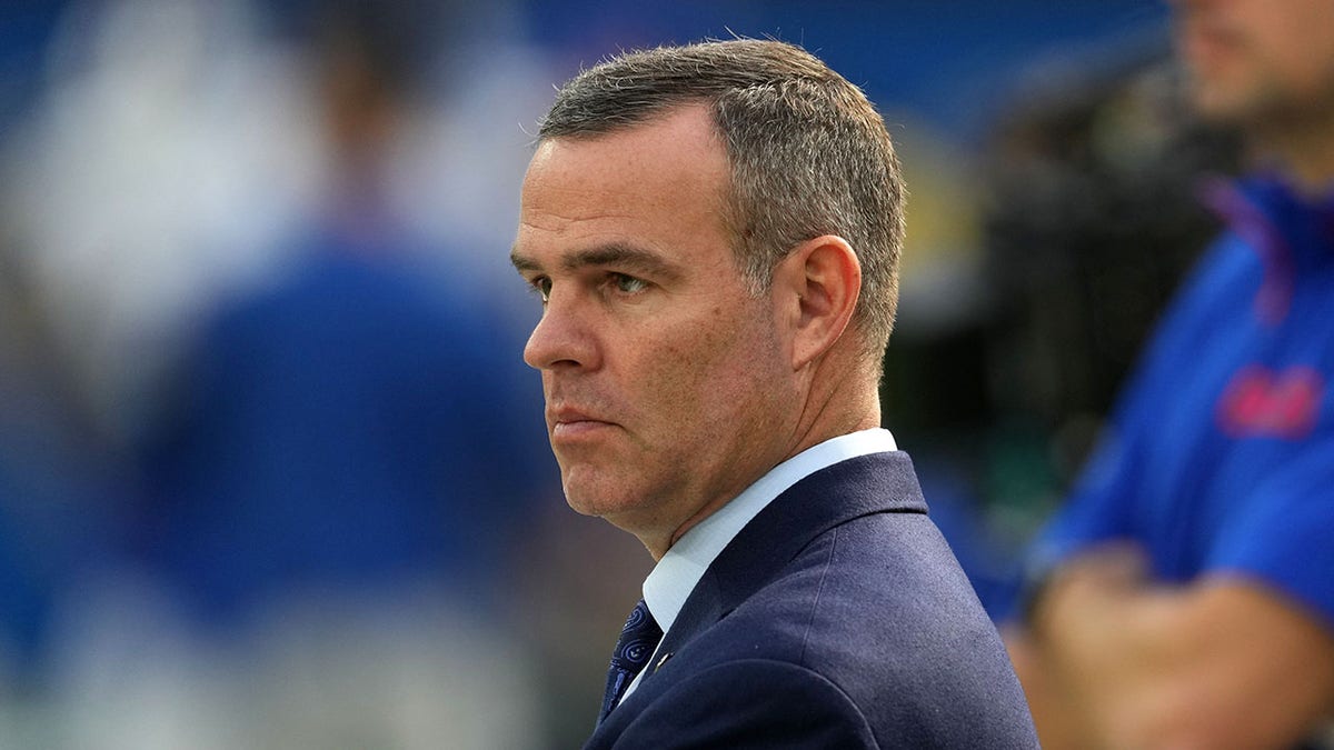 Brandon Beane looks on field