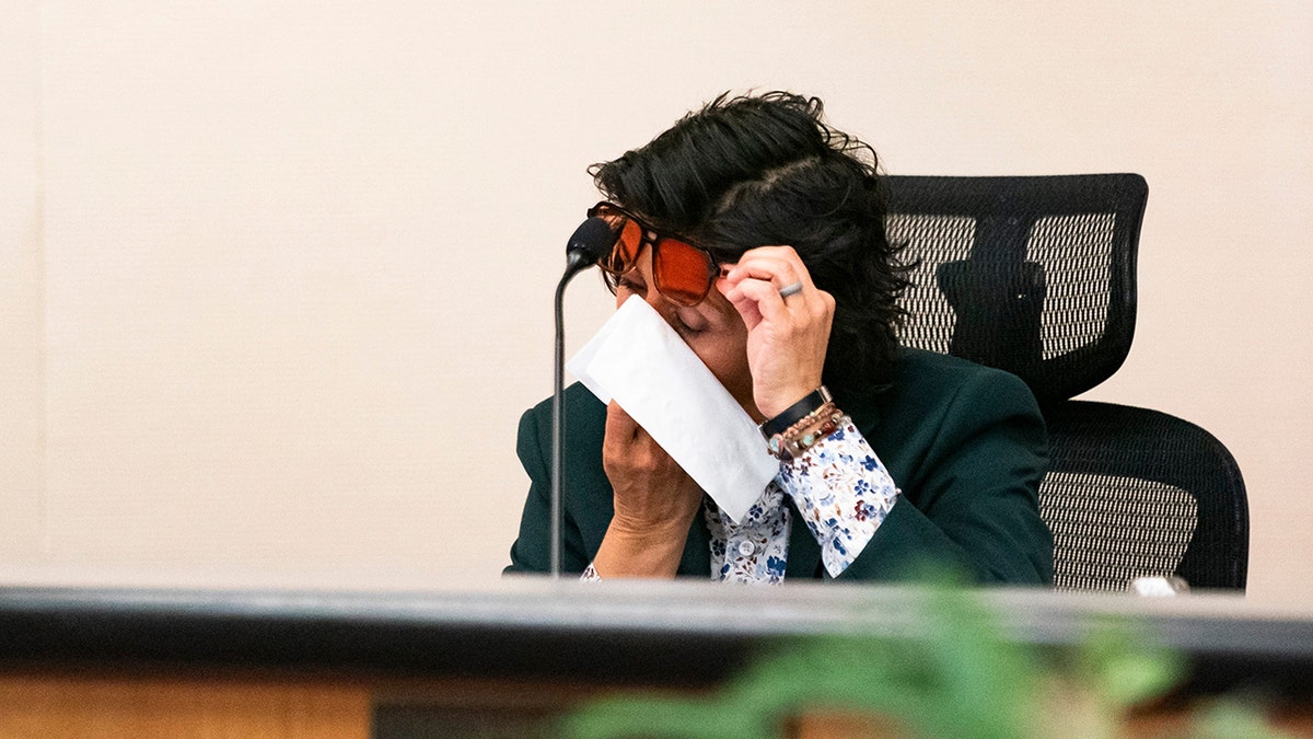 A Fort Myers councilmember cries during a meeting about immigration