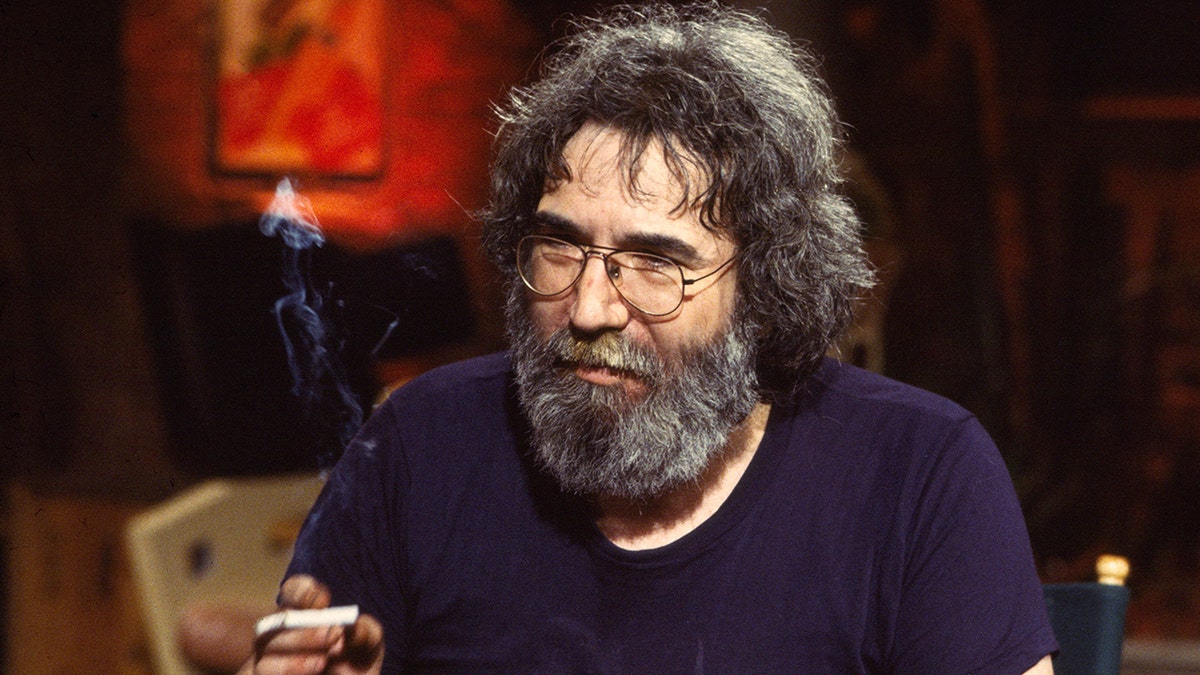 Jerry Garcia holding a cigarette.