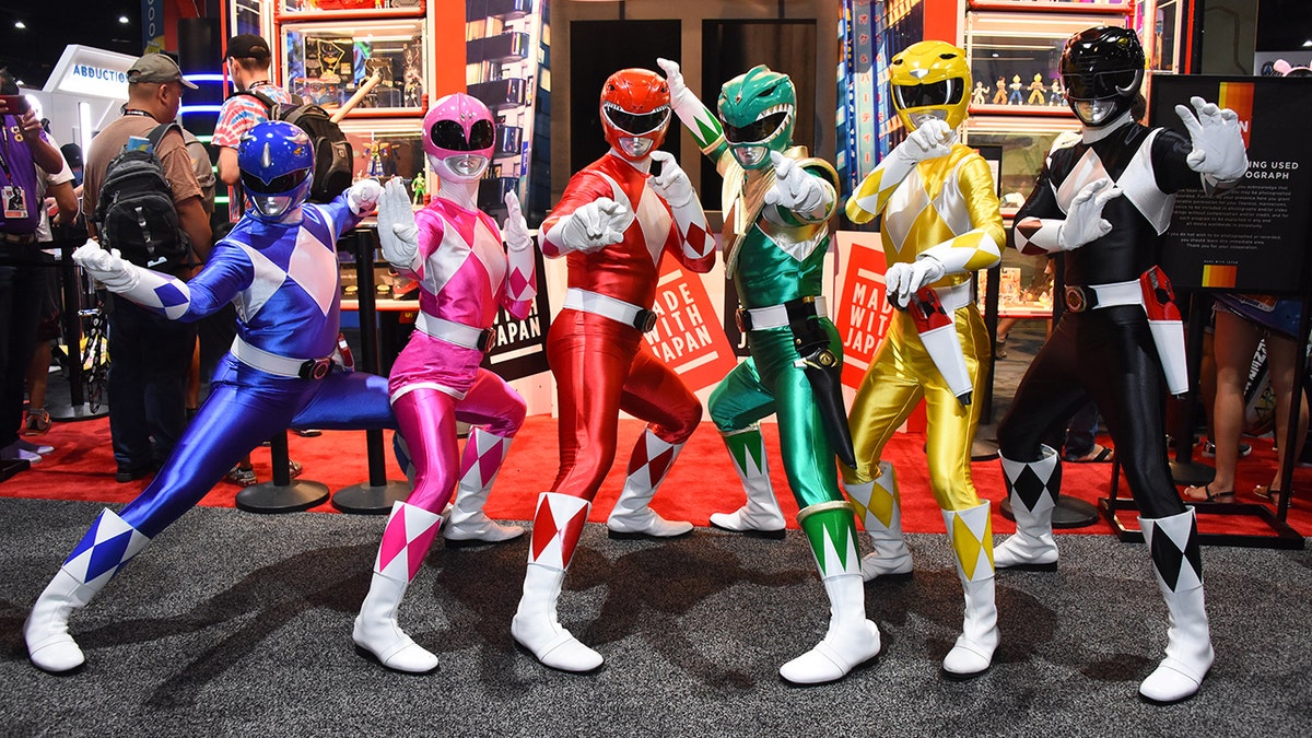 Cast of the Power Rangers in costume.