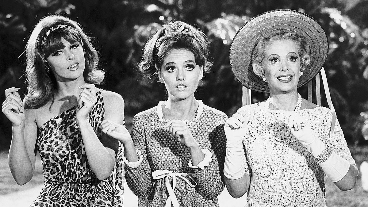 Tina Louise posing alongside her two "Gilligan's Island" castmates wearing leopard.