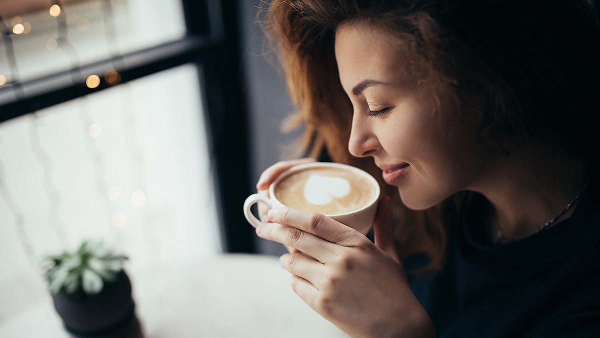 woman drinking coffee