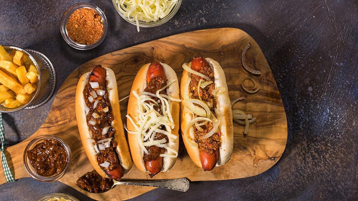 Freshly grilled hot dogs with lots of toppings