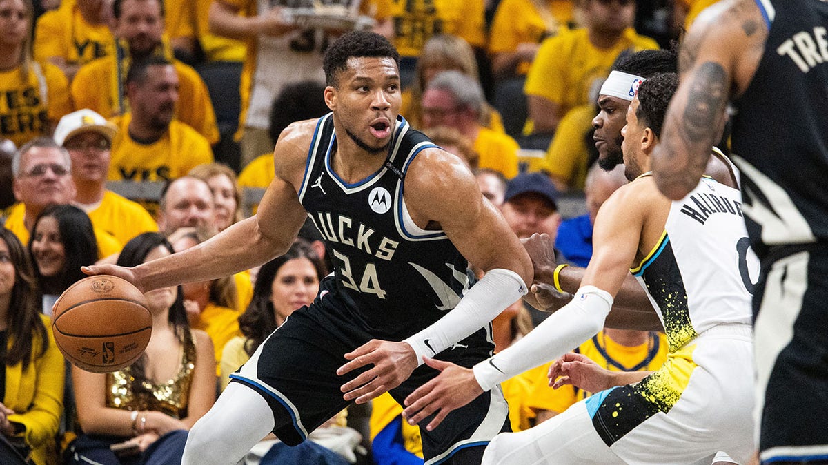 Giannis Antetokounmpo dribbles