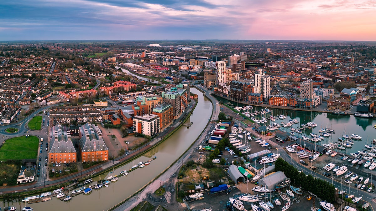 An aerial photograph of nan Wet Dock successful Ipswich, Suffolk, UK astatine sunrise