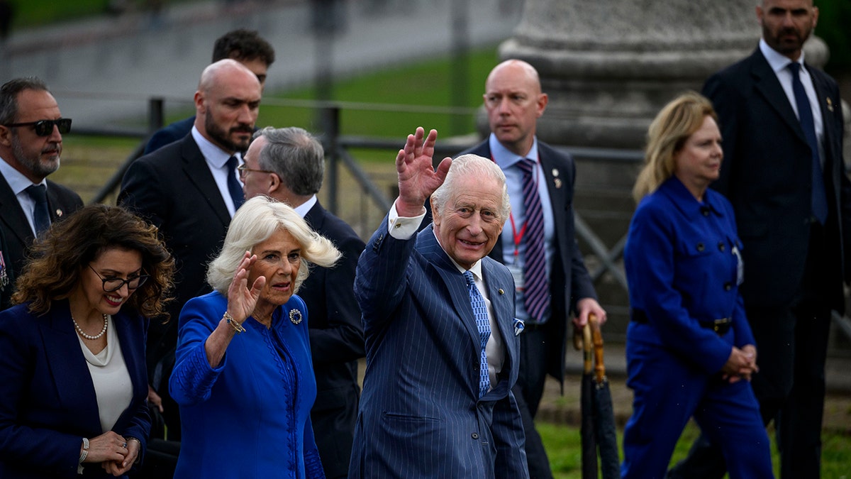King Charles and Queen Camilla are waving to the crowd outside Rome.