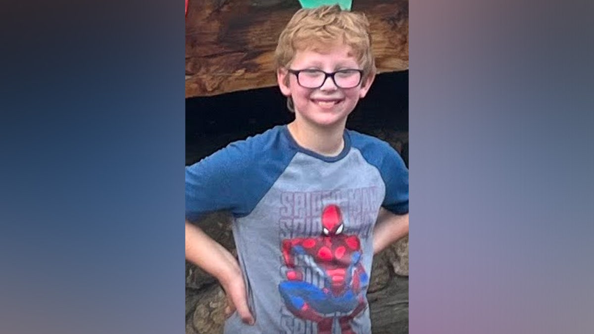 Oliver wearing a Spider-Man shirt