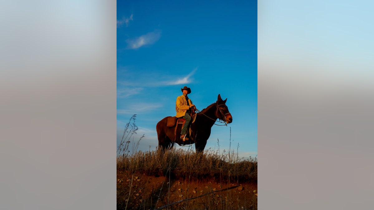Tom Green riding Fanny in a field.
