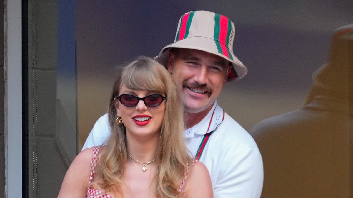 Taylor Swift and Travis Kelce embracing at the 2024 US Open Tennis Championships in New York City