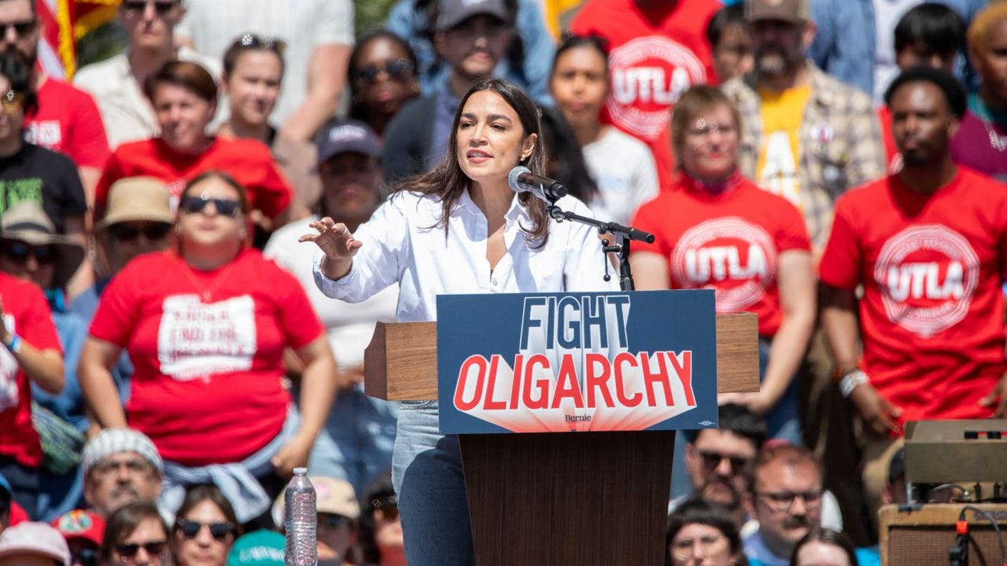 ocasio cortez at a fight oligarchy rally